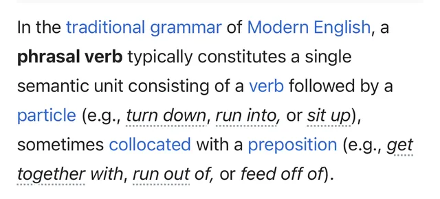 A Wikipedia page in Safari with phrasal verbs underlined with a dotted line
